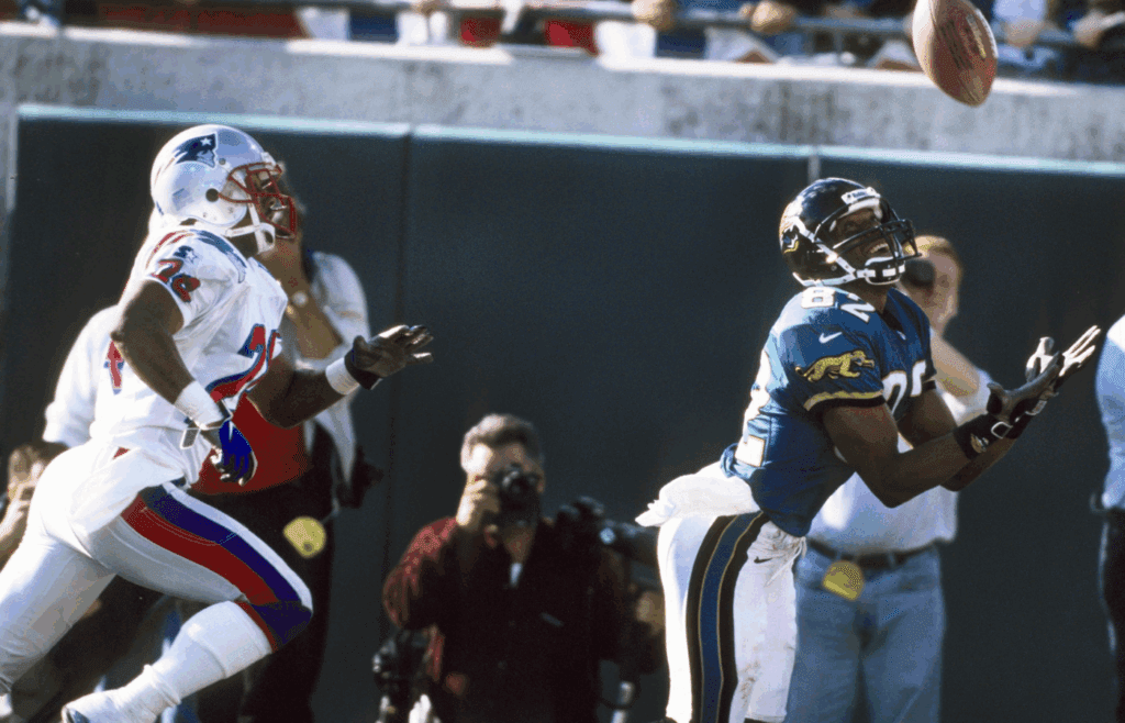 Jan 3, 1999; Jacksonville, FL, USA; FILE PHOTO; Jacksonville Jaguars receiver Jimmy Smith (82) catches a touchdown pass against the New England Patriots during the 1998 AFC Wild Card Playoff Game where the Jaguars defeated the Patriots 25-10 at Jacksonville stadium. Mandatory Credit: RVR Photos-Imagn Images