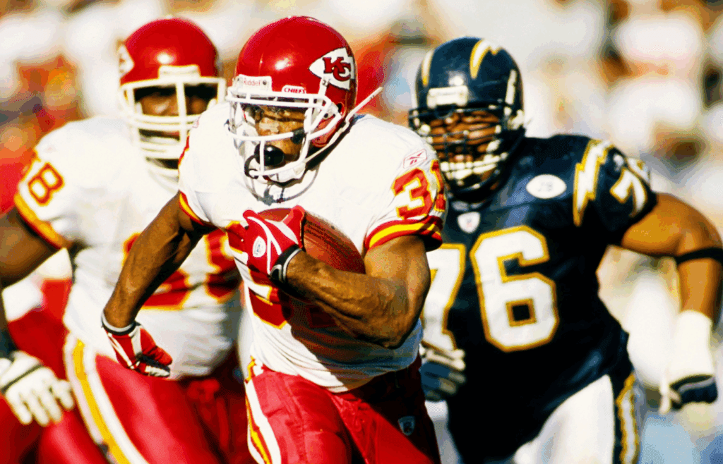 Nov 30, 2003; San Diego, CA, USA; FILE PHOTO; Kansas City Chiefs running back Priest Holmes (31) pursued by San Diego Chargers defense tackle Jamal Williams (76) at Qualcomm Stadium. Mandatory Credit: Peter Brouillet-USA TODAY NETWORK