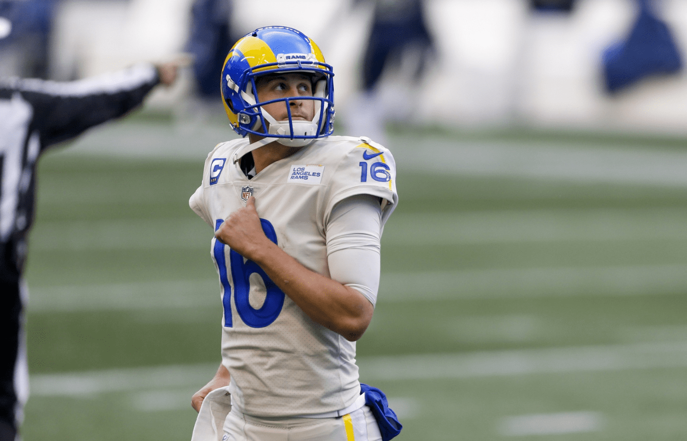 Dec 27, 2020; Seattle, Washington, USA; Los Angeles Rams quarterback Jared Goff (16) returns to the sideline following a turnover on downs against the Seattle Seahawks during the third quarter at Lumen Field. Mandatory Credit: Joe Nicholson-Imagn Images
