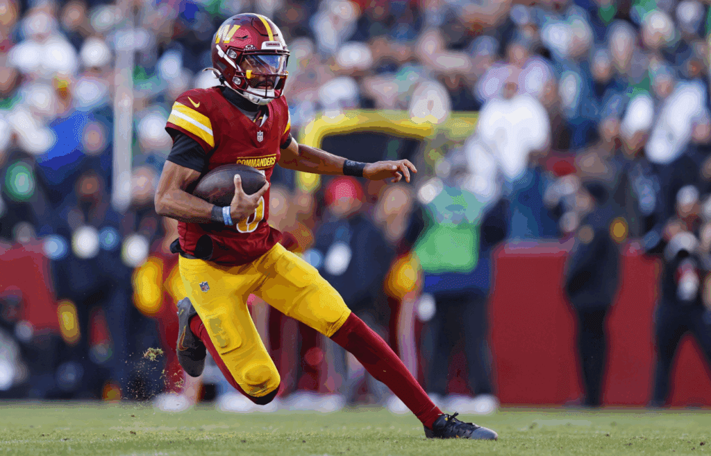 Dec 22, 2024; Landover, Maryland, USA; Washington Commanders quarterback Jayden Daniels (5) runs the ball during the third quarter against the Philadelphia Eagles at Northwest Stadium. Mandatory Credit: Peter Casey-Imagn Images
