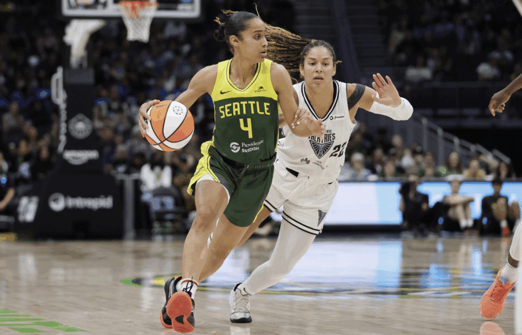Jul 16, 2025; Seattle, Washington, USA; Seattle Storm guard Skylar Diggins (4) drives the ball past Golden State Valkyries guard Veronica Burton (22) during the second half at Climate Pledge Arena. Mandatory Credit: John Froschauer-Imagn Images