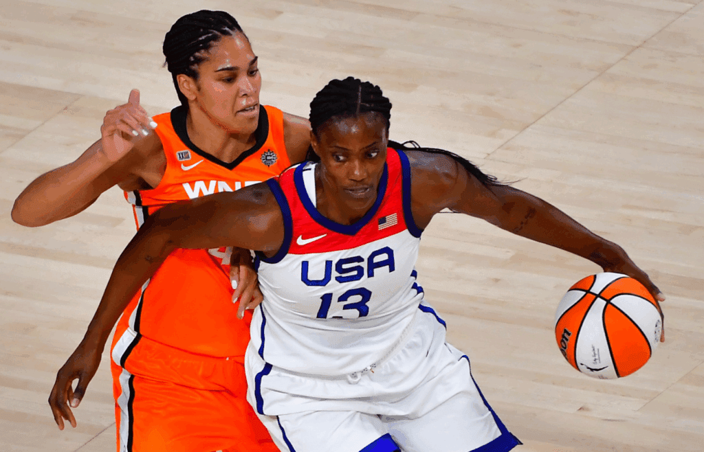 Jul 14, 2021; Las Vegas, NV, USA; Team USA center Sylvia Fowles (13) dribbles around WNBA All Star forward Brionna Jones (42) during the WNBA All Star Game at Michelob Ultra Arena at Mandalay Bay Resort. Mandatory Credit: Stephen R. Sylvanie-Imagn Images