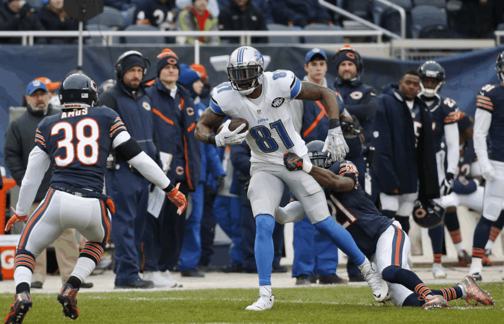 Jan 3, 2016; Chicago, IL, USA; Detroit Lions wide receiver Calvin Johnson (81) is tackled by Chicago Bears strong safety Ryan Mundy (21) during the first half at Soldier Field. Mandatory Credit: Kamil Krzaczynski-Imagn Images