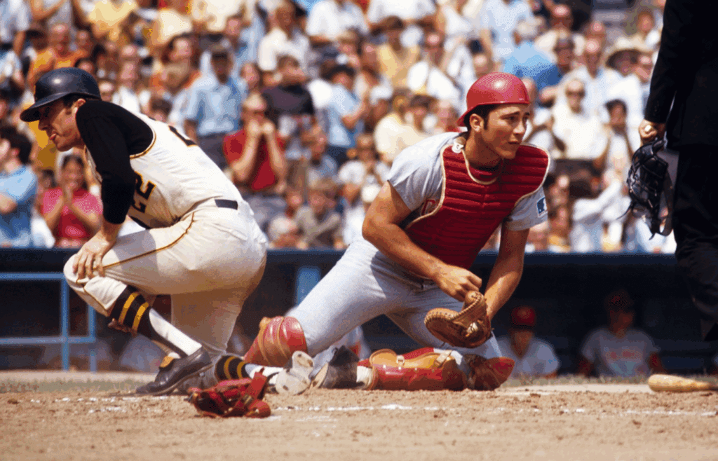 Aug 1969; Pittsburgh, PA, USA; FILE PHOTO; Cincinnati Reds catcher Johnny Bench in action at the plate against Pittsburgh Pirates infielder Gene Alley at Forbes Field. Mandatory Credit: Tony Tomsic-USA TODAY NETWORK