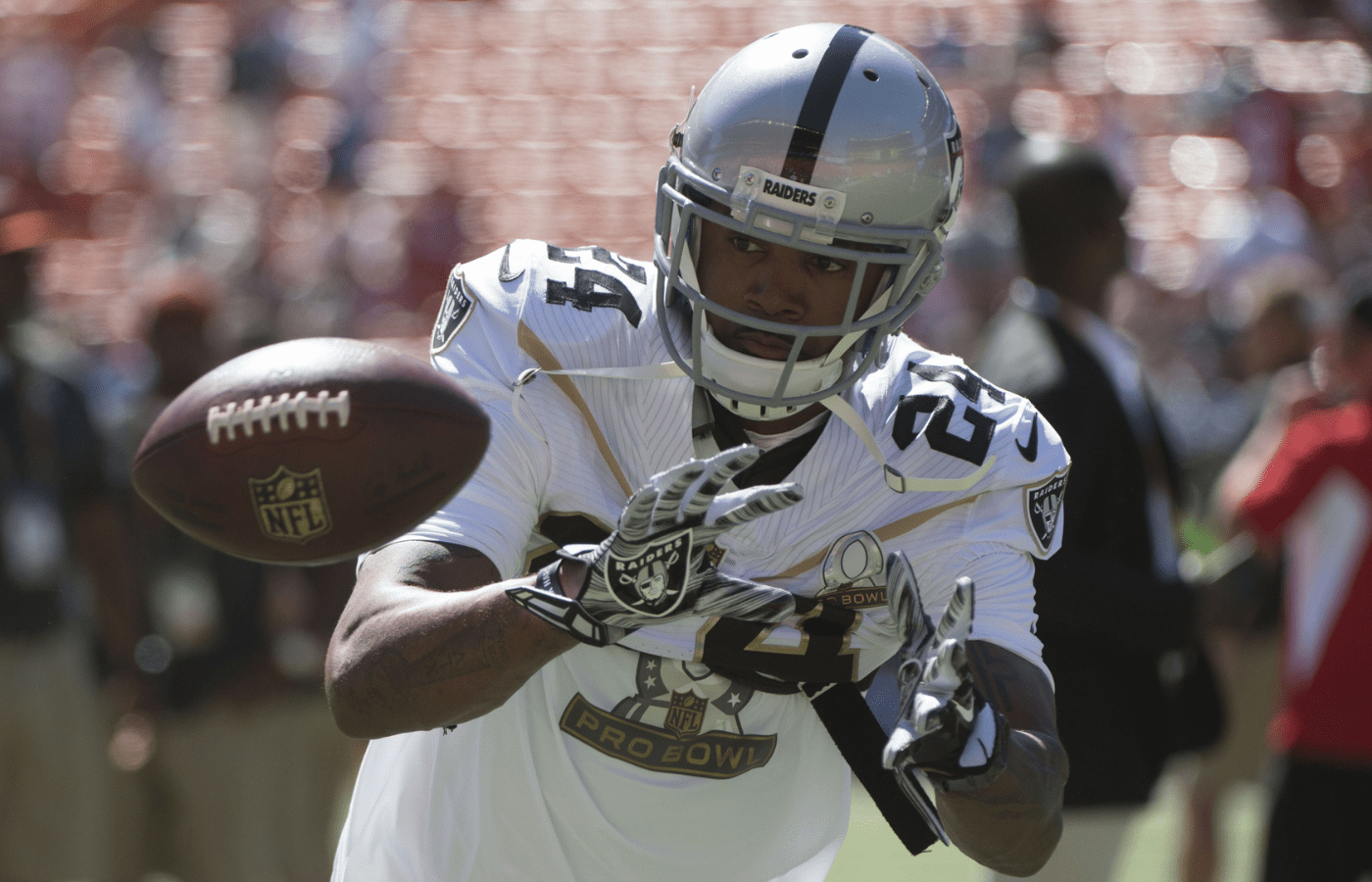 January 31, 2016; Honolulu, HI, USA; Team Rice strong safety Charles Woodson of the Oakland Raiders (24) catches the football before the 2016 Pro Bowl game at Aloha Stadium. Mandatory Credit: Kyle Terada-Imagn Images