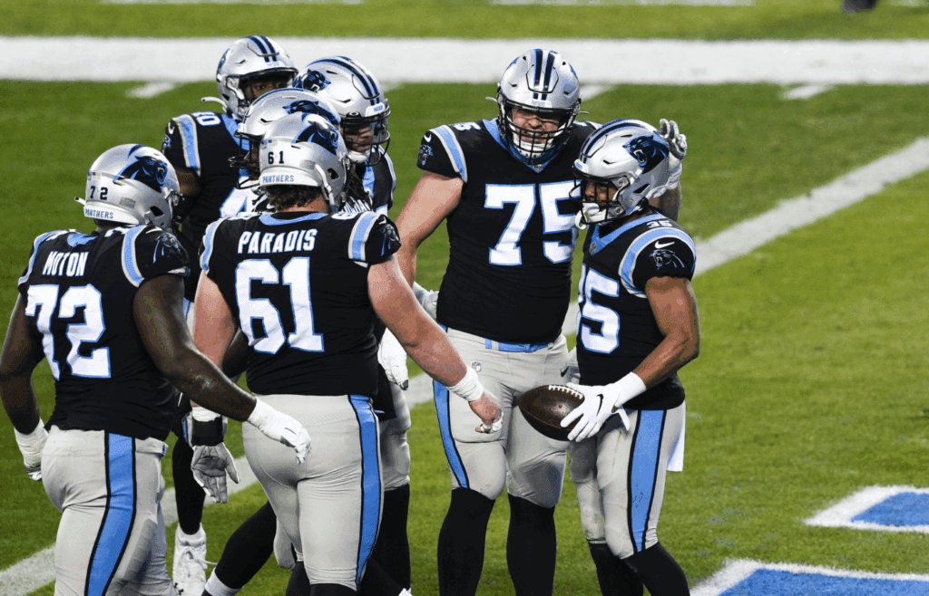 Jan 3, 2021; Charlotte, North Carolina, USA; Carolina Panthers running back Rodney Smith (35) with offensive tackle Taylor Moton (72) and center Matt Paradis (61) and offensive guard Michael Schofield (75) after scoring a touchdown in the first quarter at Bank of America Stadium. Mandatory Credit: Bob Donnan-Imagn Images