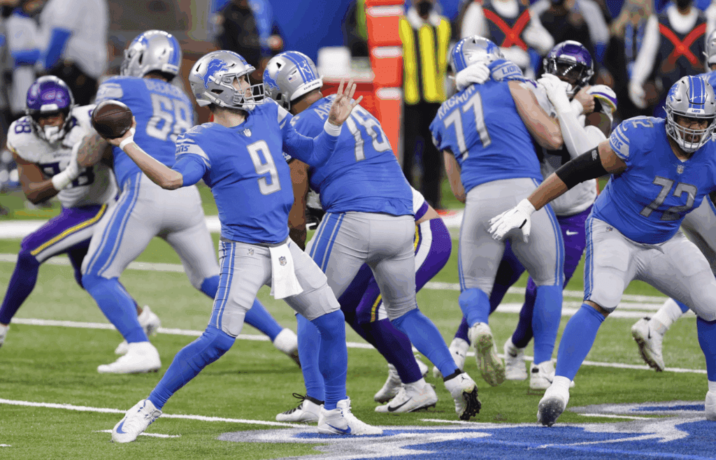 Jan 3, 2021; Detroit, Michigan, USA; Detroit Lions quarterback Matthew Stafford (9) makes a touchdown pass to wide receiver Marvin Jones (not pictured) against the Minnesota Vikings during the first quarter at Ford Field. Mandatory Credit: Raj Mehta-Imagn Images