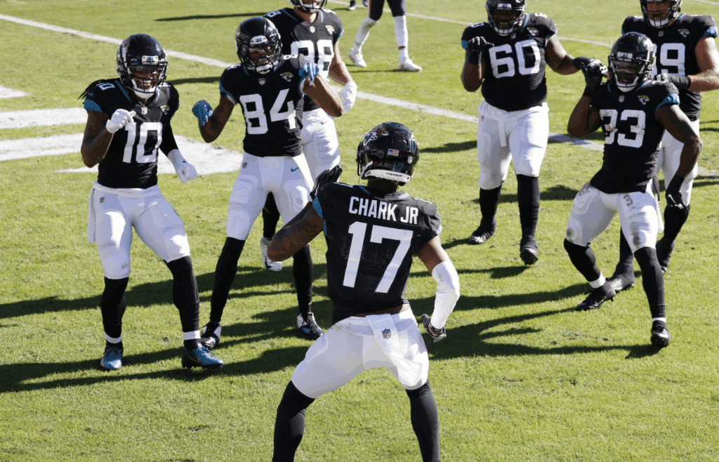 Dec 27, 2020; Jacksonville, Florida, USA; Jacksonville Jaguars wide receiver DJ Chark Jr. (17) does a celebratory dance for teammates following a touchdown catch against the Chicago Bears during the second quarter at TIAA Bank Field. Mandatory Credit: Reinhold Matay-Imagn Images