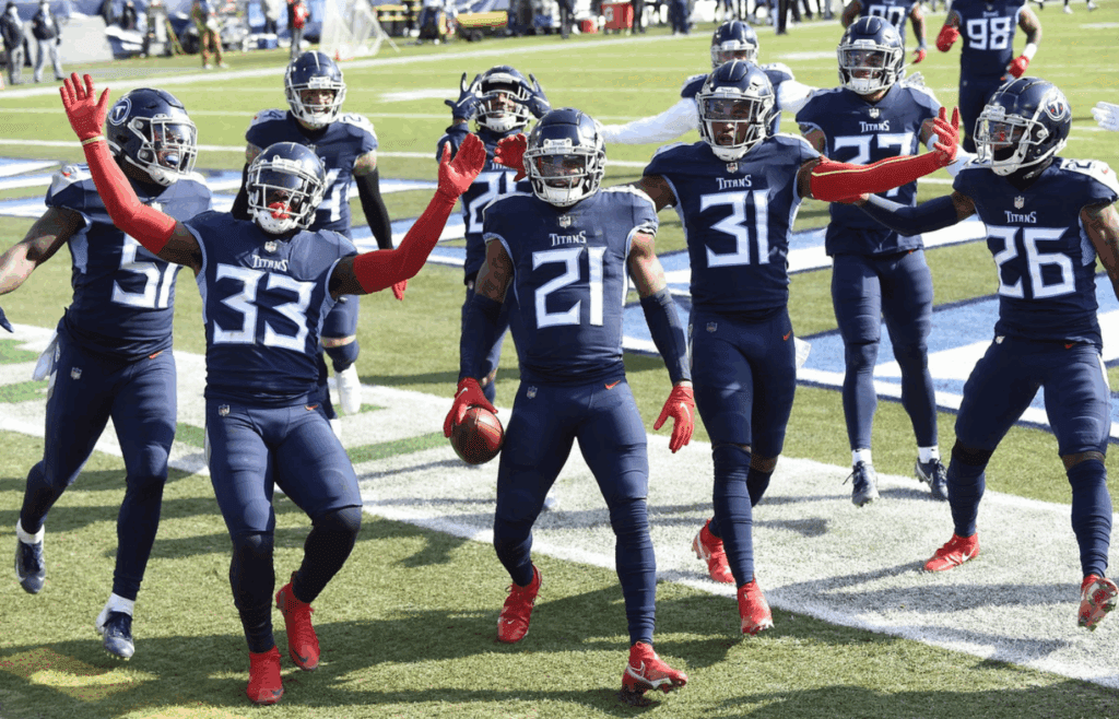 Jan 10, 2021; Nashville, Tennessee, USA;Tennessee Titans cornerback Malcolm Butler (21) and the team celebrate his interception in the first quarter during the Tennessee Titans game against the Baltimore Ravens. Mandatory Credit: George Walker IV/The Tennessean via Imagn Images