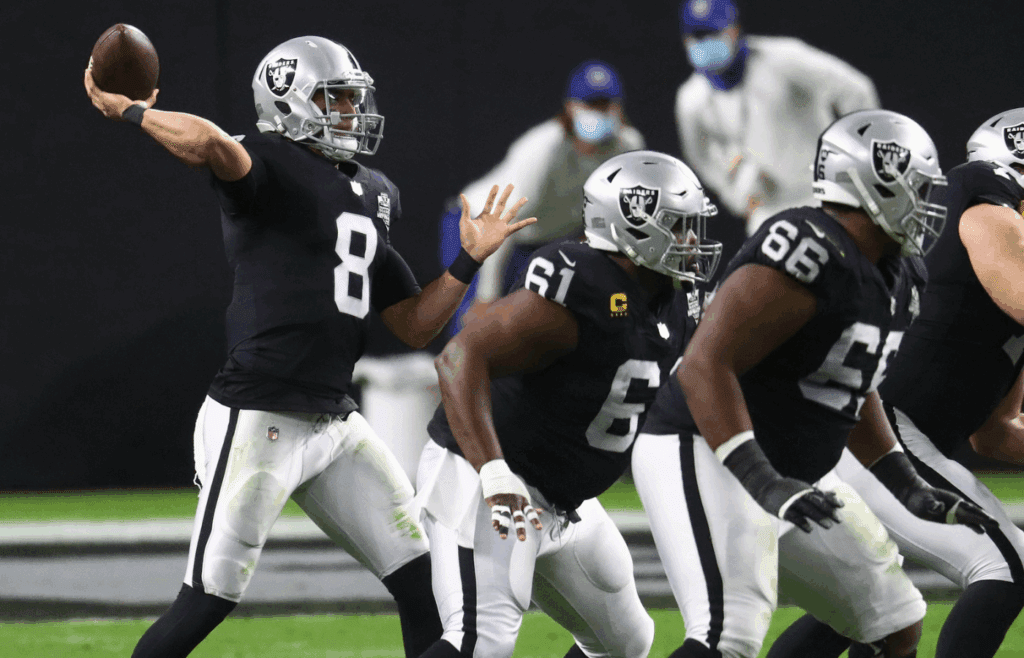 Dec 17, 2020; Paradise, Nevada, USA; Las Vegas Raiders quarterback Marcus Mariota (8) throws against the Los Angeles Chargers during the first half at Allegiant Stadium. Mandatory Credit: Mark J. Rebilas-Imagn Images