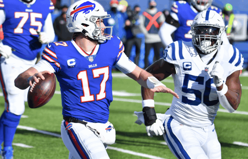 Jan 9, 2021; Orchard Park, New York, USA; Buffalo Bills quarterback Josh Allen (17) looks to throw a pass as Indianapolis Colts defensive end Justin Houston (50) applies pressure in the first quarter at Bills Stadium. Mandatory Credit: Mark Konezny-Imagn Images