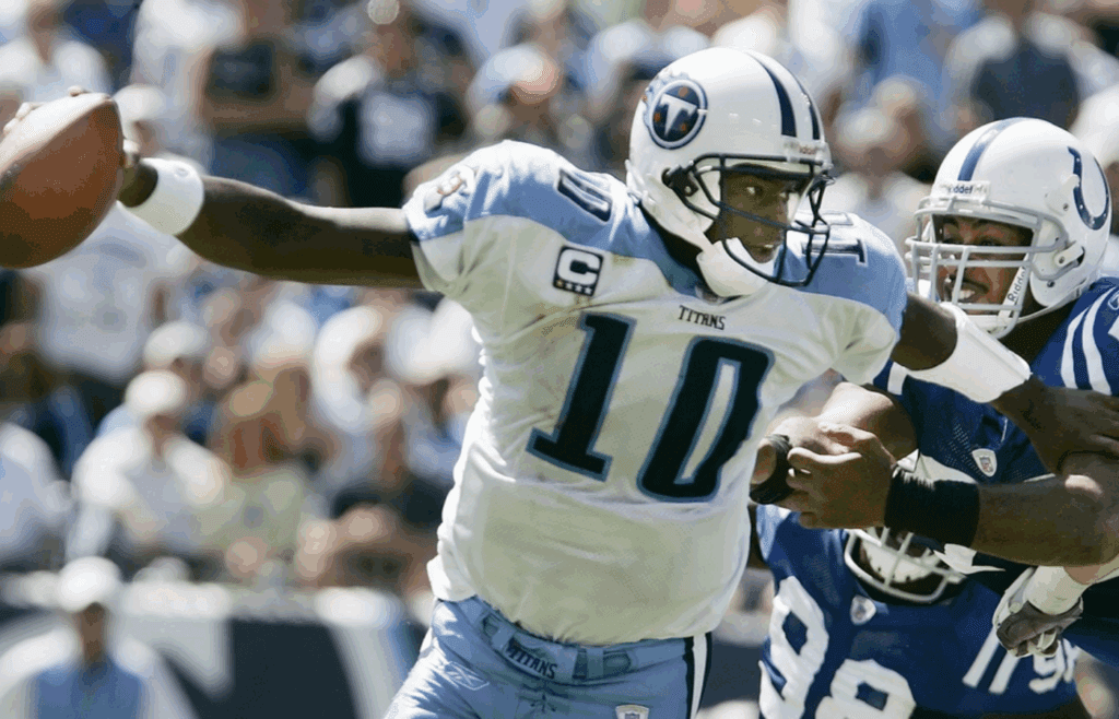 Tennessee Titans quarterback Vince Young (10) scrambles to get away from Indianapolis colts defenders at LP field in Nashville on Sept 16, 2007. The Titans lost their home opener 22-20.
