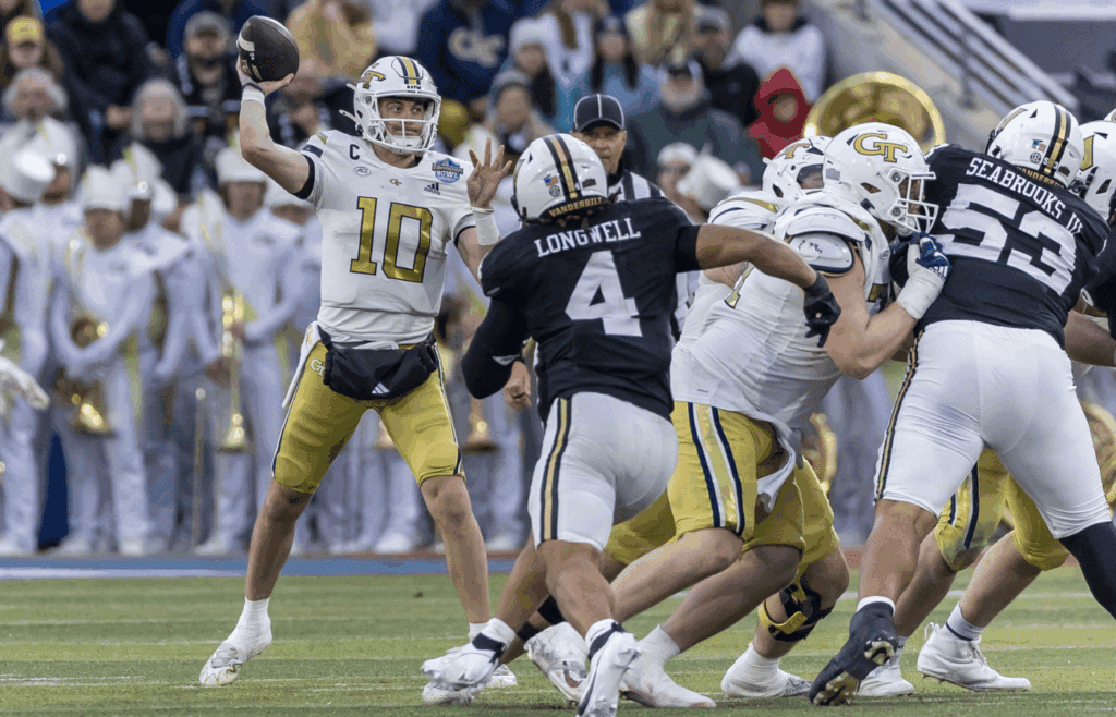 Dec 27, 2024; Birmingham, AL, USA; Georgia Tech Yellow Jackets quarterback Haynes King (10) looks to throw against the Vanderbilt Commodores during the first half of the 2024 Birmingham Bowl at Protective Stadium. Mandatory Credit: Vasha Hunt-Imagn Images