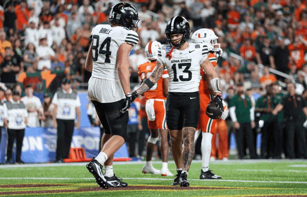 Dec 28, 2024; Orlando, FL, USA; Iowa State Cyclones wide receiver Jaylin Noel (13) celebrates with tight end Gabe Burkle (84) after scoring a touchdown against the Miami Hurricanes in the third quarter during the Pop Tarts bowl at Camping World Stadium. Mandatory Credit: Nathan Ray Seebeck-Imagn Images