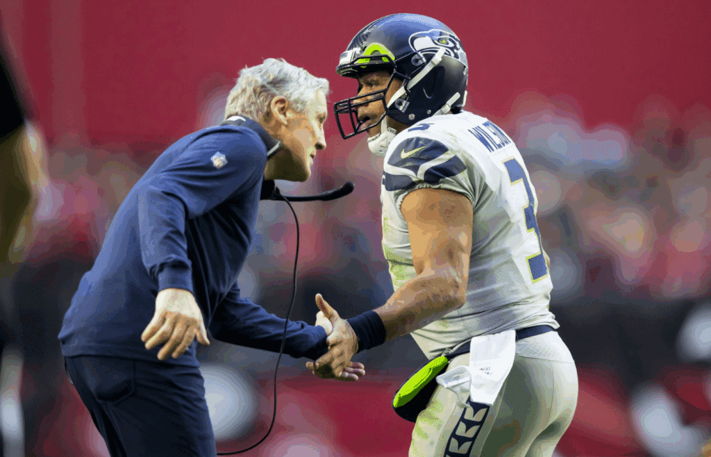 Jan 9, 2022; Glendale, Arizona, USA; Seattle Seahawks quarterback Russell Wilson (3) celebrates a touchdown with head coach Pete Carroll against the Arizona Cardinals in the first half at State Farm Stadium. Mandatory Credit: Mark J. Rebilas-Imagn Images