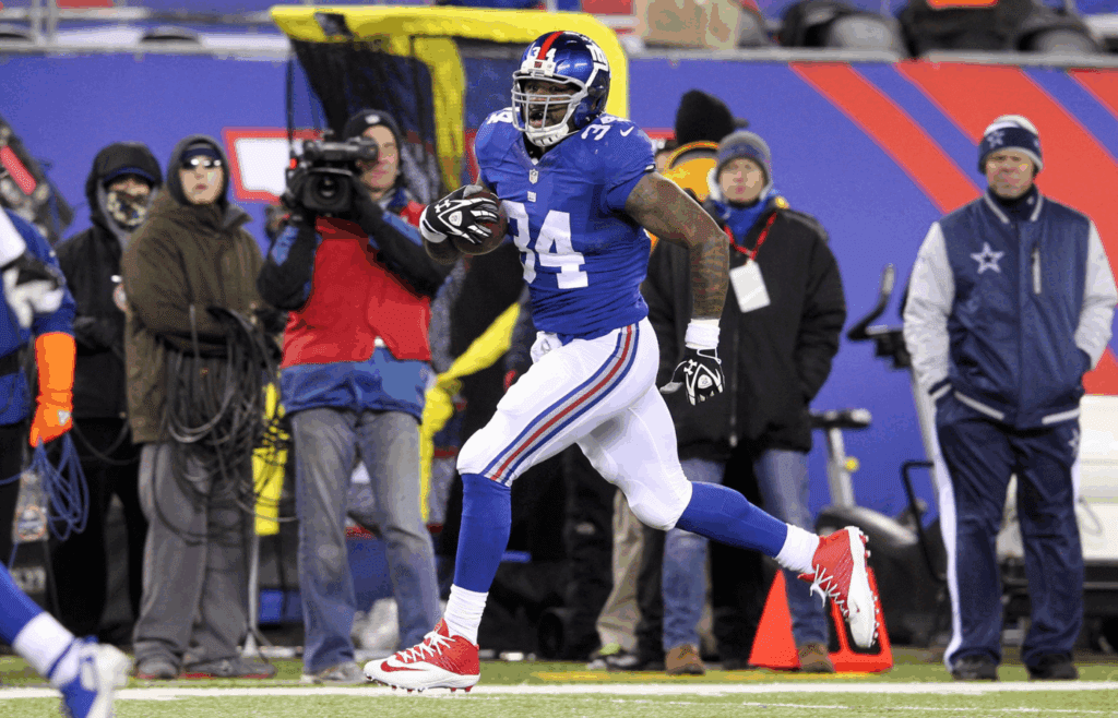 Nov 24, 2013; East Rutherford, NJ, USA; New York Giants running back Brandon Jacobs (34) runs the ball against the Dallas Cowboys during the second quarter of a game at MetLife Stadium. Mandatory Credit: Brad Penner-Imagn Images