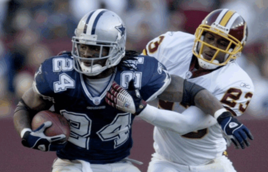 Nov 5, 2006; Landover, MD, USA; Dallas Cowboys running back (24) Marion Barber III tries to get out of the grasp of Washington Redskins safety (23) Troy Vincent at FedEx Field in Landover, MD. Mandatory Credit: Photo by Pouya Dianat-Imagn Images © Copyright Pouya Dianat
