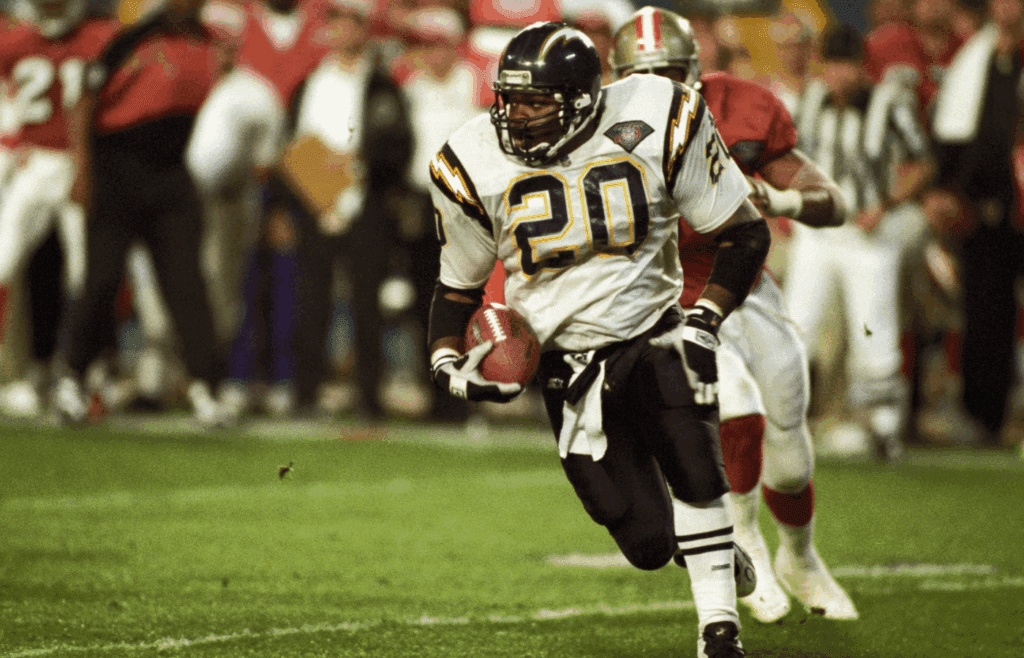 Jan 29, 1995; Miami, FL, USA; FILE PHOTO; San Diego Chargers running back Natrone Means (20) carries the ball against the San Francisco 49ers during Super Bowl XXIX at Joe Robbie Stadium. San Francisco defeated San Diego 49-26. Mandatory Credit: Manny Rubio-Imagn Images