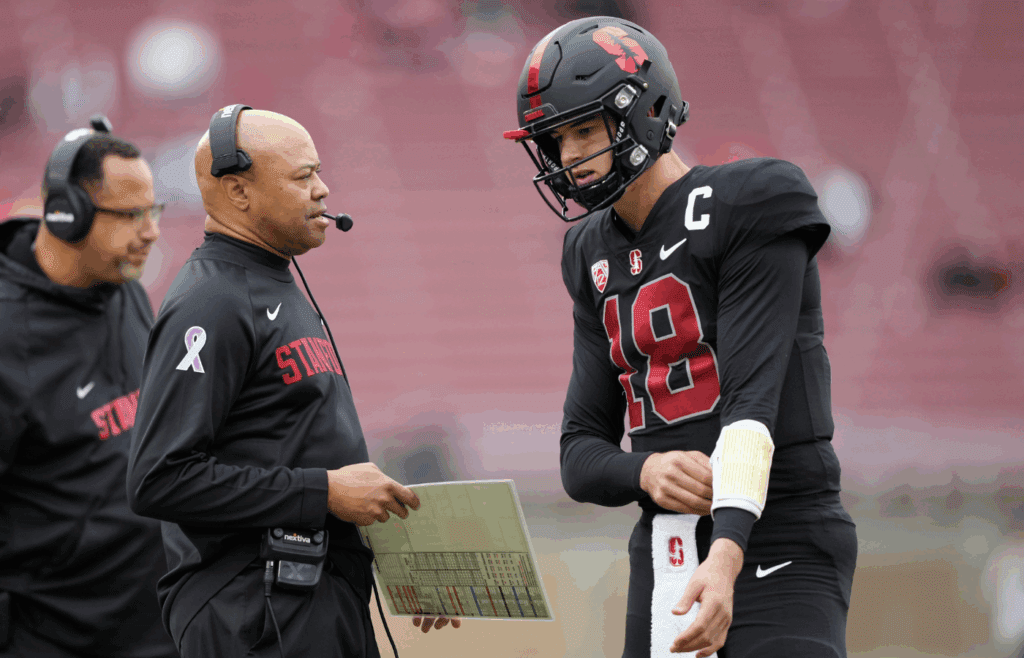 Nov 5, 2022; Stanford, California, USA; Stanford Cardinal head coach David Shaw (left) talks to quarterback Tanner McKee (18) during the third quarter against the Washington State Cougars at Stanford Stadium. Mandatory Credit: Darren Yamashita-Imagn Images