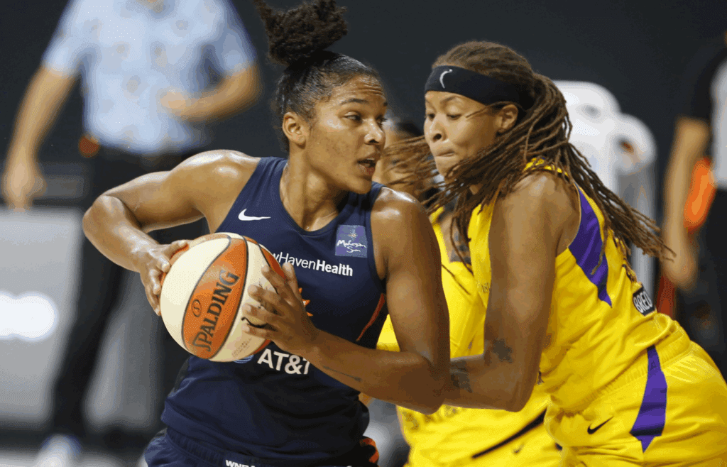 Sep 17, 2020; Palmetto, Florida, USA; Los Angeles Sparks guard Seimone Augustus (33) guards Connecticut Sun forward Alyssa Thomas (left) during the second half at the FELD entertainment complex. Mandatory Credit: Reinhold Matay-Imagn Images