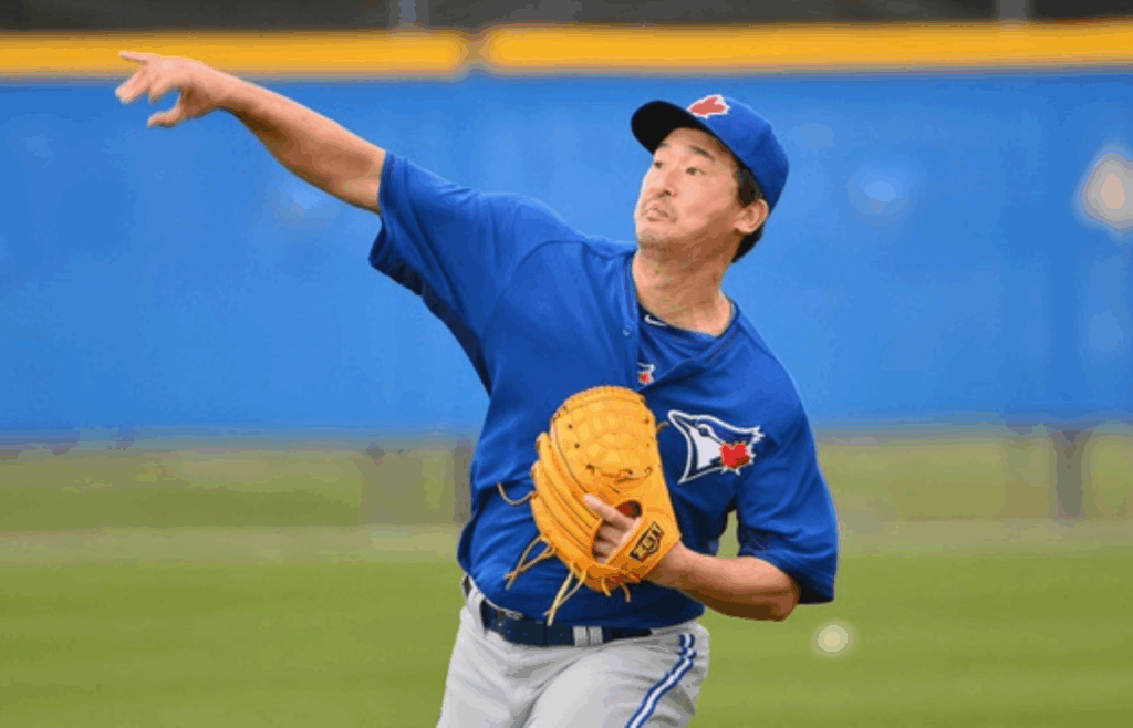 Feb 24, 2014; Dunedin, FL, USA; Toronto Blue Jays pitcher Tomo Ohka (55) throws during practice at Bobby Mattick Training Center . Mandatory Credit: Tommy Gilligan-Imagn Images
