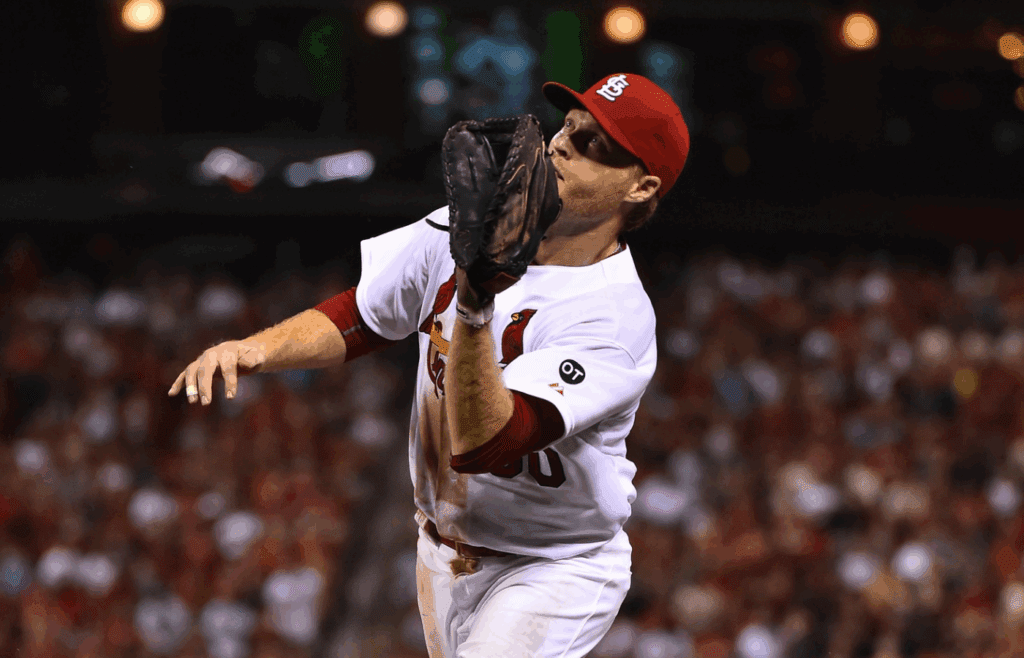 Jul 27, 2015; St. Louis, MO, USA; St. Louis Cardinals first baseman Dan Johnson (30) catches a pop up against the Cincinnati Reds at Busch Stadium. Mandatory Credit: Jasen Vinlove-Imagn Images