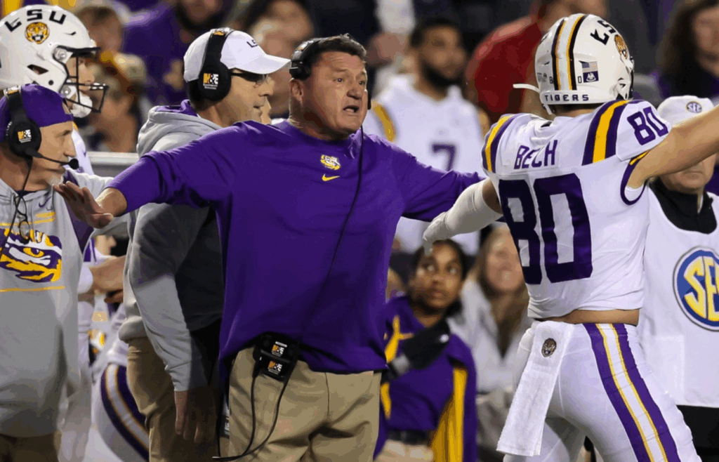 Nov 27, 2021; Baton Rouge, Louisiana, USA; LSU Tigers head coach Ed Orgeron reacts after a play against the Texas A&M Aggies during the first half at Tiger Stadium. Mandatory Credit: Stephen Lew-Imagn Images