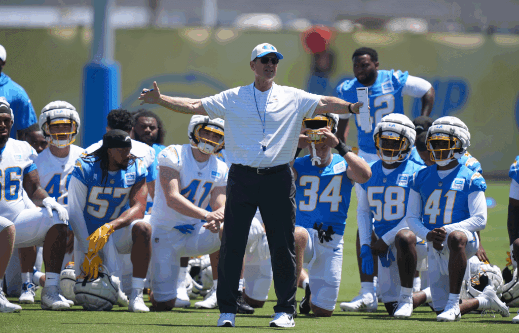 May 7, 2025; El Segundo CA, USA; Los Angeles Chargers coach Jim Harbaugh talks to players during rookie minicamp at The Bolt. Mandatory Credit: Kirby Lee-Imagn Images