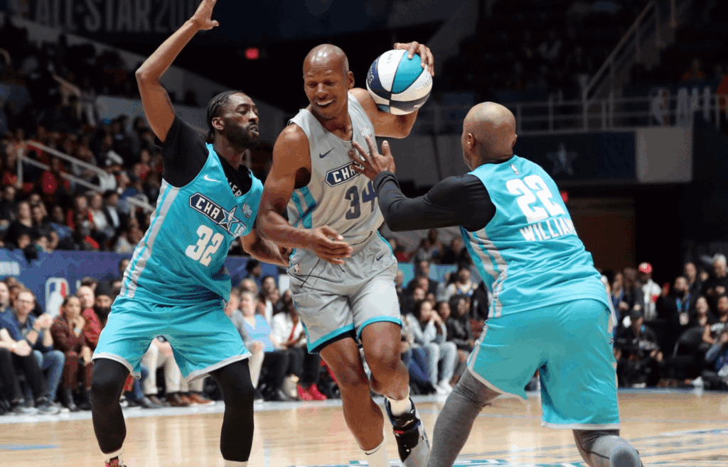 Feb 15, 2019; Charlotte, NC, USA; Away Team player Ray Allen is guarded by Home Team player Famous Los and player Jay Williams at Bojangles Coliseum . Mandatory Credit: Jim Dedmon-Imagn Images