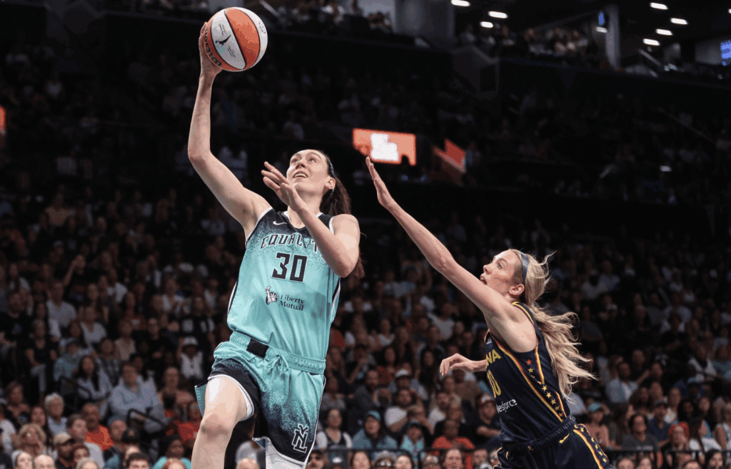 Jul 22, 2025; Brooklyn, New York, USA; New York Liberty forward Breanna Stewart (30) drives past Indiana Fever guard Lexie Hull (10) in the first quarter at Barclays Center. Mandatory Credit: Wendell Cruz-Imagn Images