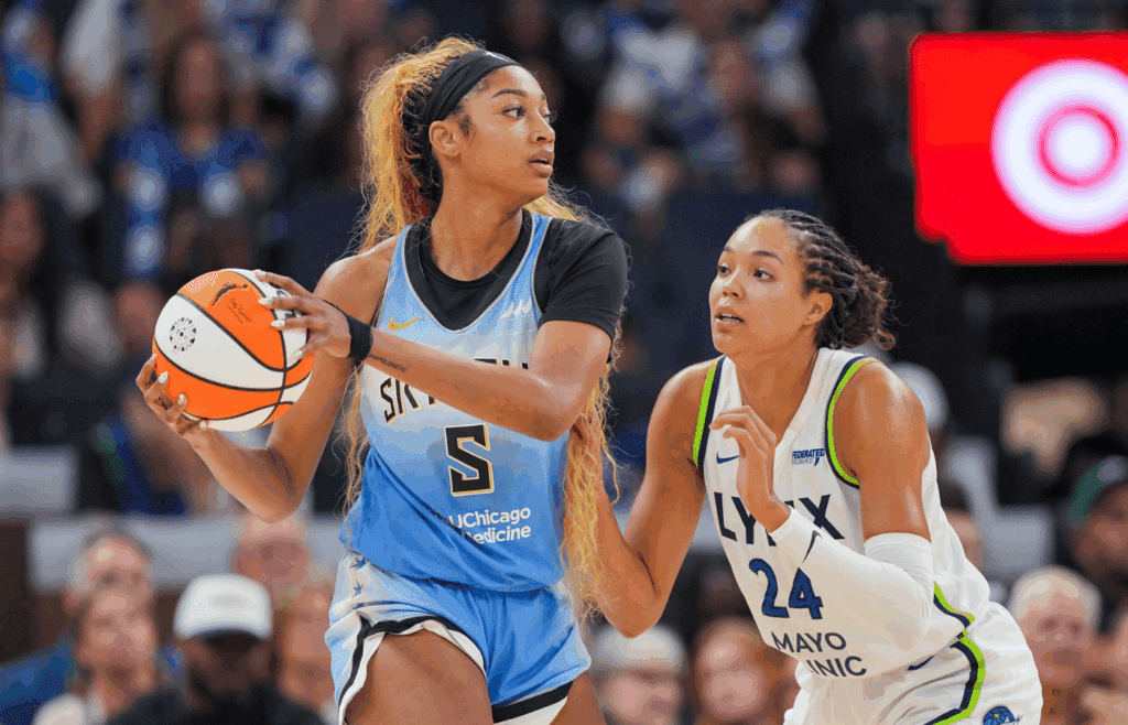 Jul 22, 2025; Minneapolis, Minnesota, USA; Minnesota Lynx forward Napheesa Collier (24) defends Chicago Sky forward Angel Reese (5) in the fourth quarter at Target Center. Mandatory Credit: Brad Rempel-Imagn Images
