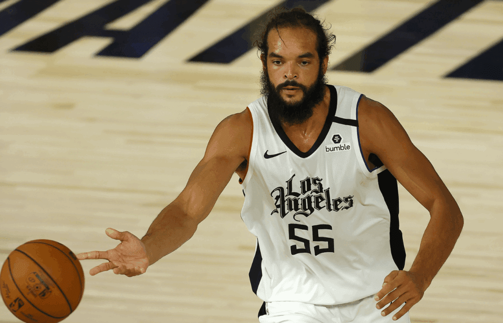 Aug 14, 2020; Lake Buena Vista, Florida, USA; Joakim Noah #55 of the LA Clippers dribbles the ball against the Oklahoma City Thunder during overtime at The Field House at ESPN Wide World of Sports Complex. Mandatory Credit: Mike Ehrmann/Pool Photo-Imagn Images