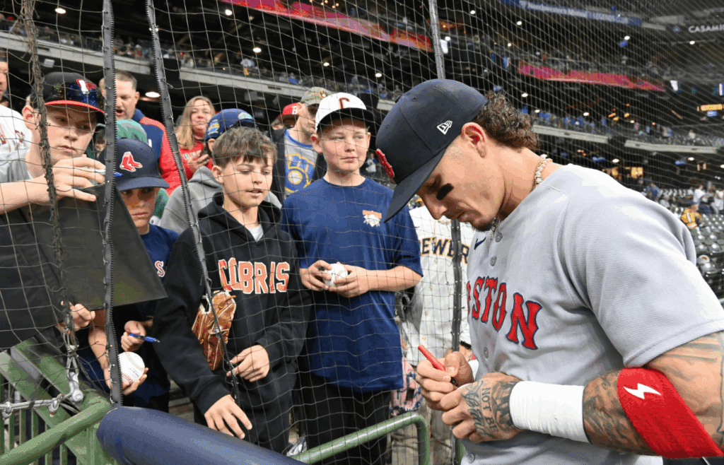 May 28, 2025; Milwaukee, Wisconsin, USA; Boston Red Sox left fielder Jarren Duran (16) signs autographs for young fans prior to a game against the Milwaukee Brewers at American Family Field. Mandatory Credit: Patrick Gorski-Imagn Images