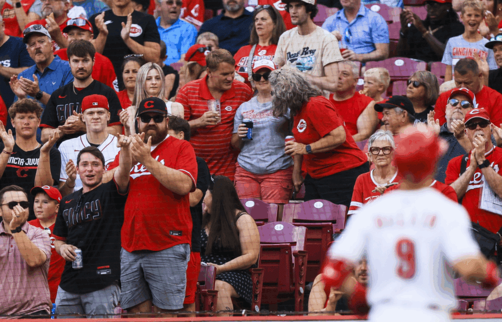 Jul 8, 2025; Cincinnati, Ohio, USA; Fans cheer as Cincinnati Reds second baseman Matt McLain (9) crosses the plate after hitting a solo home run in the first inning against the Miami Marlins at Great American Ball Park. Mandatory Credit: Katie Stratman-Imagn Images
