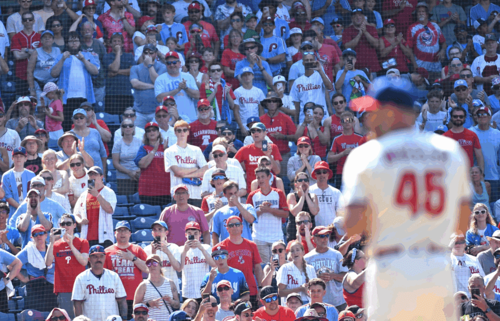 Jul 6, 2025; Philadelphia, Pennsylvania, USA; Fans stand for the final out during the ninth inning as Philadelphia Phillies pitcher Zack Wheeler (45) pitches a complete game one-hit win against the Cincinnati Reds at Citizens Bank Park. Mandatory Credit: Eric Hartline-Imagn Images