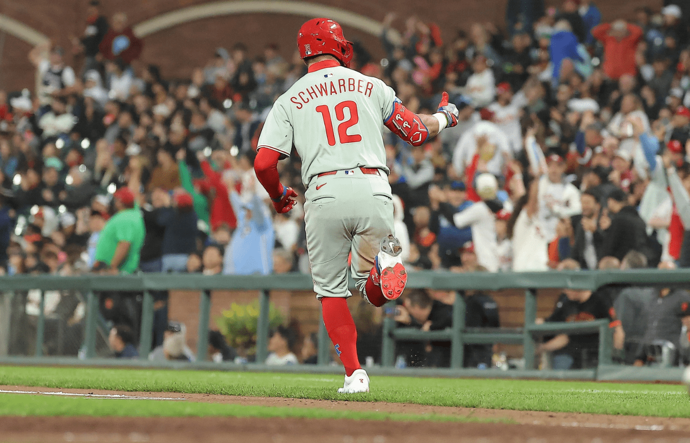 Jul 8, 2025; San Francisco, California, USA; Philadelphia Phillies designated hitter Kyle Schwarber (12) gestures towards fans as he rounds the bases on a two-run home run to bat in pinch hitter Brandon Marsh (16) against the San Francisco Giants during the seventh inning at Oracle Park. Mandatory Credit: Kelley L Cox-Imagn Images
