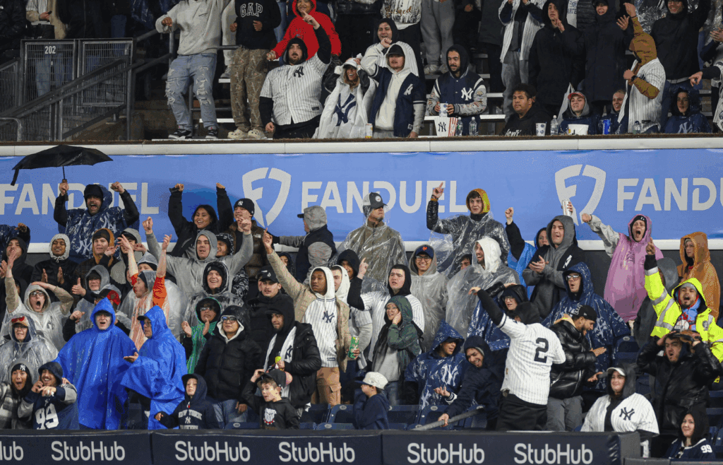Apr 11, 2025; Bronx, New York, USA; Fans react after an RBI double by New York Yankees catcher Austin Wells (28) during the third inning against the San Francisco Giants at Yankee Stadium. Mandatory Credit: Vincent Carchietta-Imagn Images