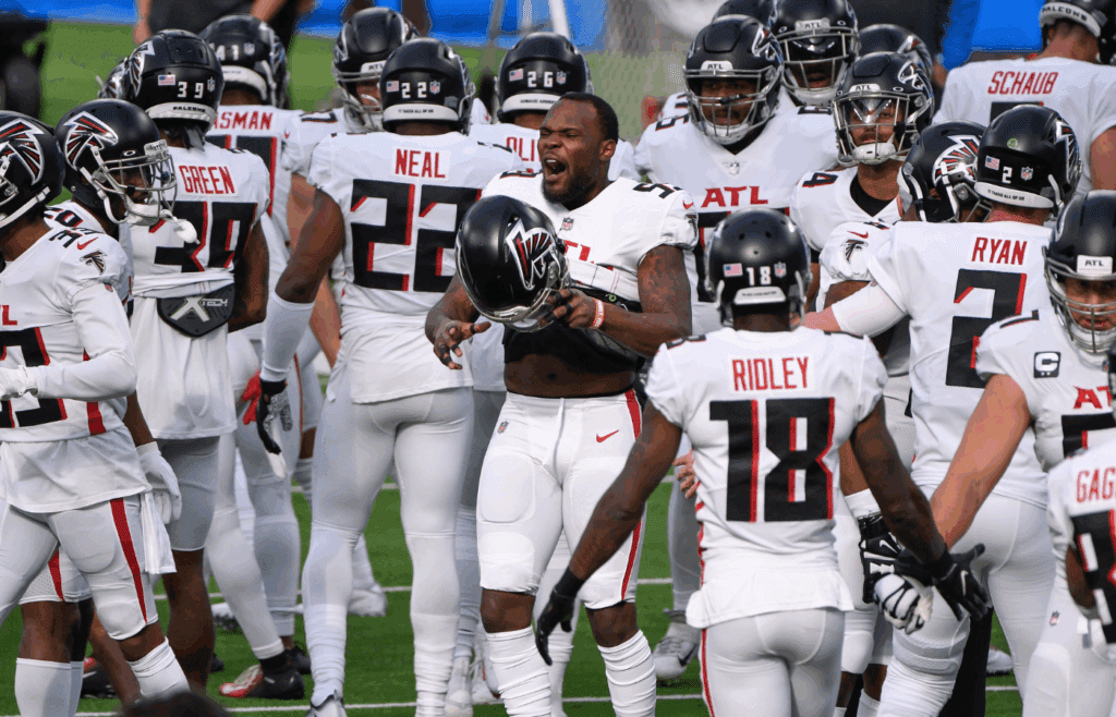 Dec 13, 2020; Inglewood, California, USA; Atlanta Falcons linebacker LaRoy Reynolds (59) puts on his helmet as he and the rest of the team take the field for pregame warmups before playing the Los Angeles Chargers at SoFi Stadium. Mandatory Credit: Robert Hanashiro-Imagn Images