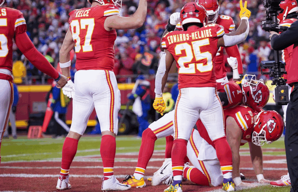 Dec 10, 2023; Kansas City, Missouri, USA; Kansas City Chiefs running back Jerick McKinnon (1) celebrates with team mates after a score against the Buffalo Bills during the first half at GEHA Field at Arrowhead Stadium. Mandatory Credit: Denny Medley-Imagn Images