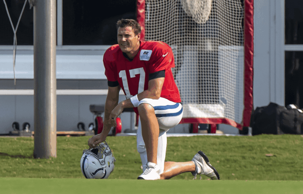 Aug 26, 2020; Indianapolis, Indiana, USA; Indianapolis Colts quarterback Phillip Rivers (17) takes a knee during colts training camp at the Farm Bureau Football Complex. Mandatory Credit: Marc Lebryk-Imagn Images
