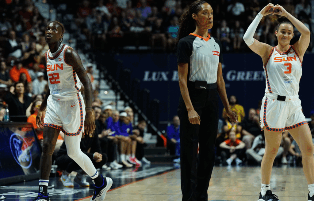 Jul 24, 2025; Uncasville, Connecticut, USA; Connecticut Sun guard Marina Mabrey (3) relives guard Saniya Rivers (22) as they take on the Los Angeles Sparks in the first half at Mohegan Sun Arena. Mandatory Credit: David Butler II-Imagn Images