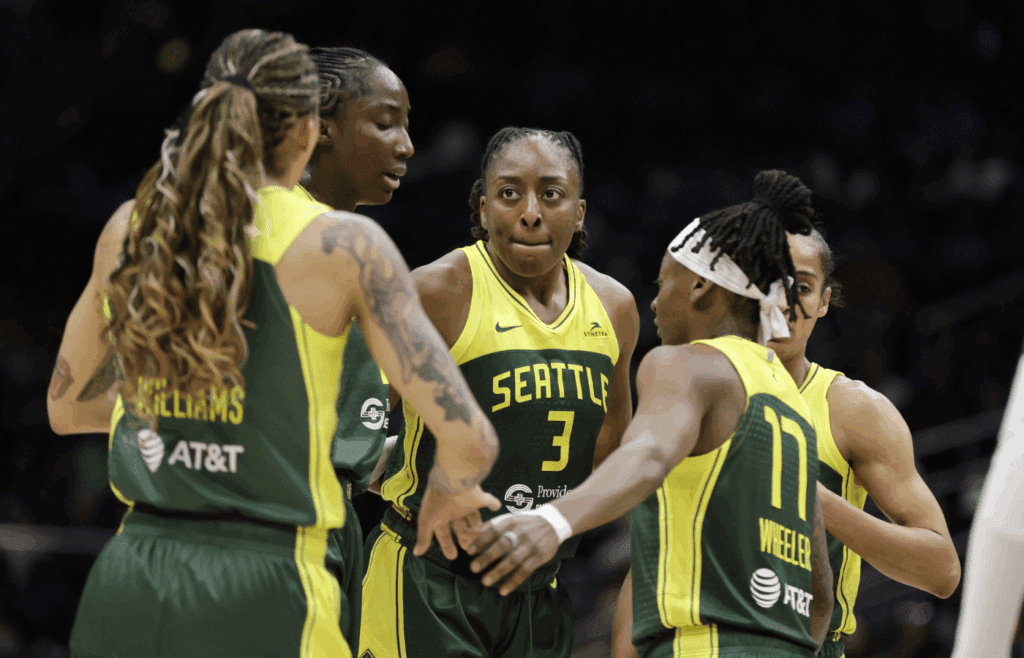 Jul 16, 2025; Seattle, Washington, USA; Seattle Storm forward Gabby Williams (5), Seattle Storm forward Nneka Ogwumike (3), Seattle Storm guard Erica Wheeler (17) and others gather against the Golden State Valkyries during the second half at Climate Pledge Arena. Mandatory Credit: John Froschauer-Imagn Images