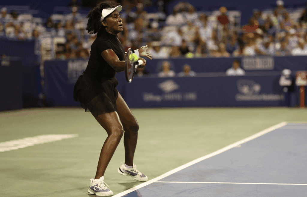 Jul 24, 2025; Washington, D.C., USA; Venus Williams (USA) hits a forehand against Magdalena Frech (POL)(not pictured) in a women's singles match on day four of the Mubadala Citi DC Open at Rock Creek Park Tennis Center. Mandatory Credit: Geoff Burke-Imagn Images