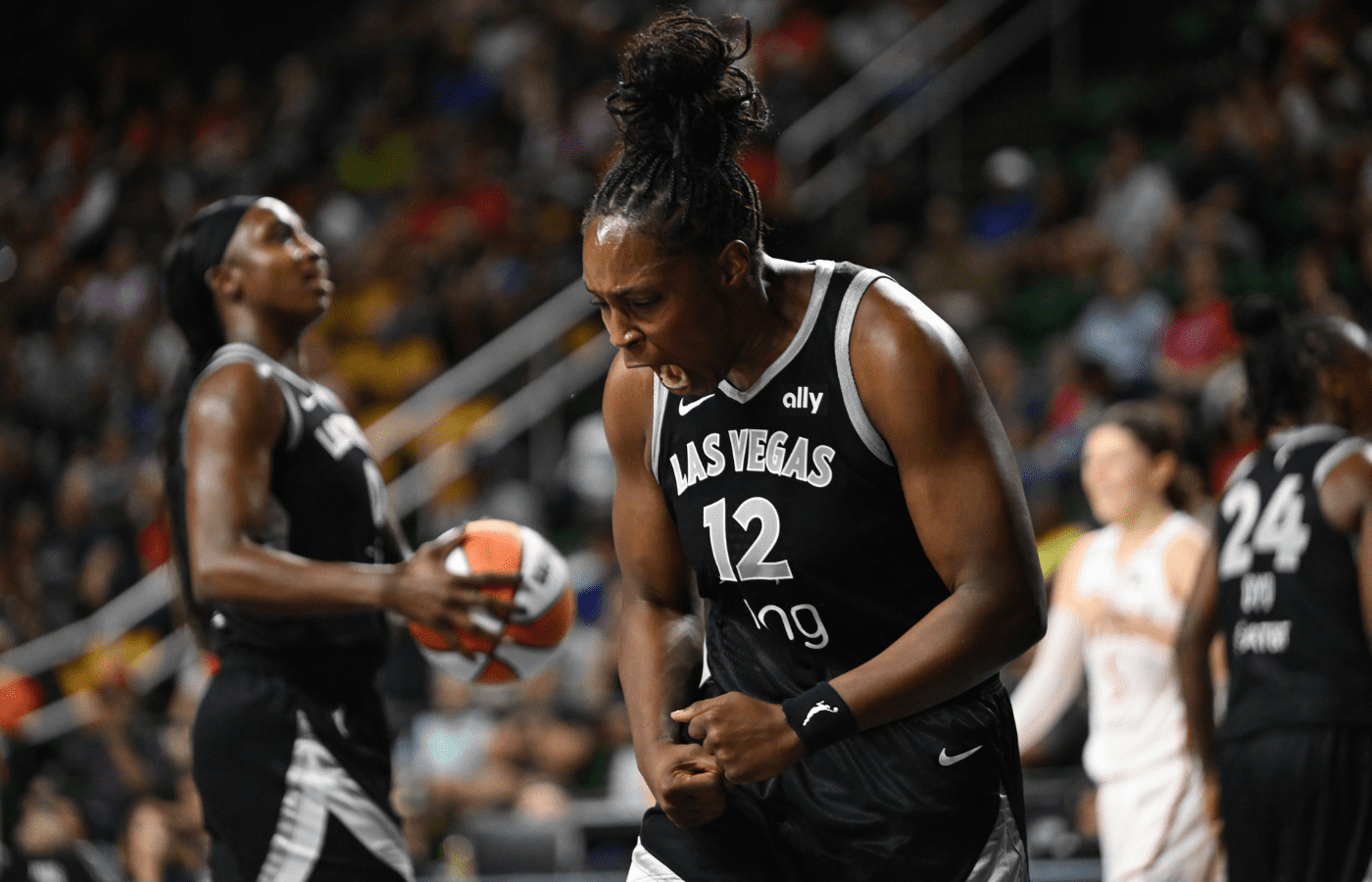 Jul 10, 2025; Washington, District of Columbia, USA; Las Vegas Aces guard Chelsea Gray (12) reacts after foul call against the Washington Mystics during the second quarter at EagleBank Arena. Mandatory Credit: Rafael Suanes-Imagn Images