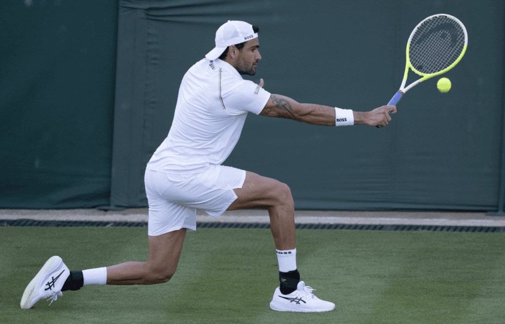 Jun 30, 2025; Wimbledon, UNITED KINGDOM; Matteo Berrettini of Italy returns a shot during his match against Kamil Majchrzak of Poland on day one at the All England Lawn Tennis and Croquet Club. Mandatory Credit: Susan Mullane-Imagn Images