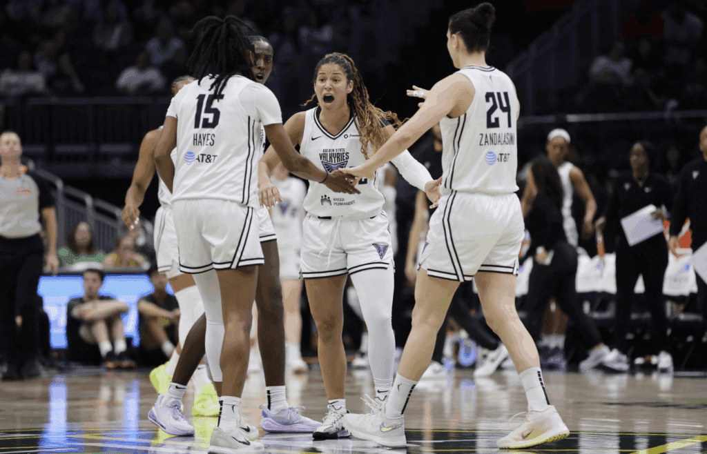 Jul 16, 2025; Seattle, Washington, USA; Golden State Valkyries guard Veronica Burton (22), talks to guard Tiffany Hayes (15), forward Cecilia Zandalasini (24) and others against the Seattle Storm during the second half at Climate Pledge Arena. Mandatory Credit: John Froschauer-Imagn Images