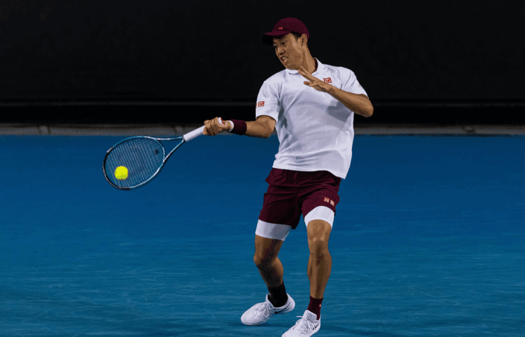 Jan 15, 2025; Melbourne, Victoria, Australia; Kei Nishikori of Japan hits a forehand during his match against Tommy Paul of United States of America in the second round of the men's singles at the 2025 Australian Open at Melbourne Park. Mandatory Credit: Mike Frey-Imagn Images