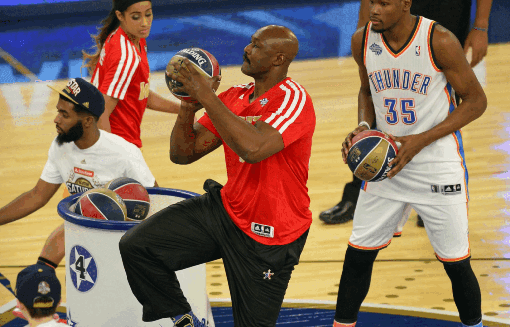 Feb 15, 2014; New Orleans, LA, USA; NBA former player Karl Malone shoots during the 2014 NBA All Star Shooting Stars competition at Smoothie King Center. Mandatory Credit: Bob Donnan-Imagn Images