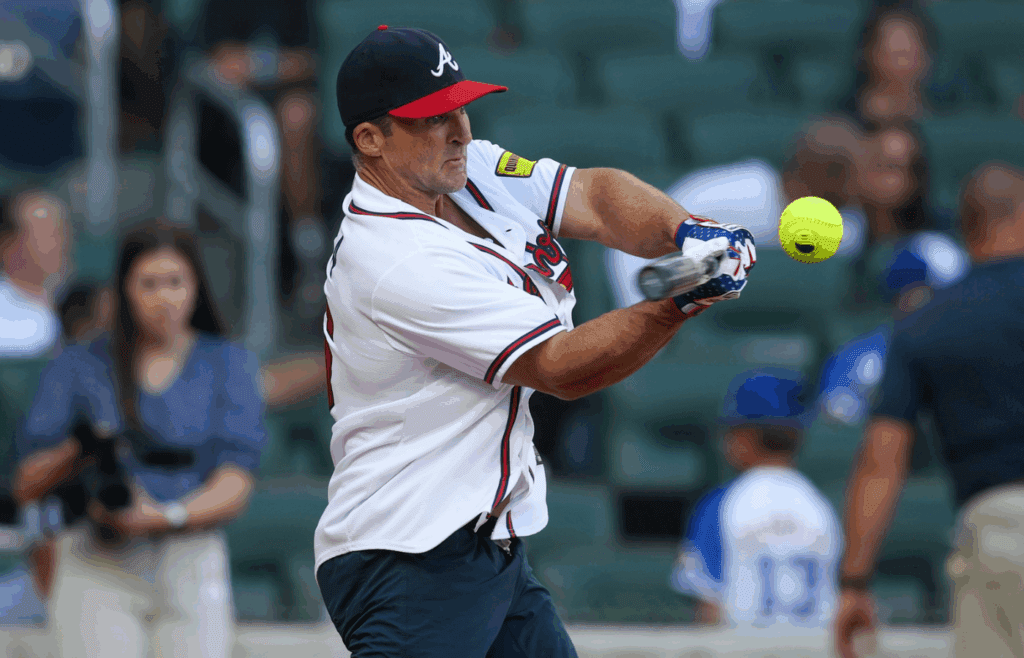 Aug 24, 2024; Atlanta, Georgia, USA; Former Atlanta Braves second baseman Dan Uggla (26) competes in a home run derby before a game against the Washington Nationals at Truist Park. Mandatory Credit: Brett Davis-Imagn Images