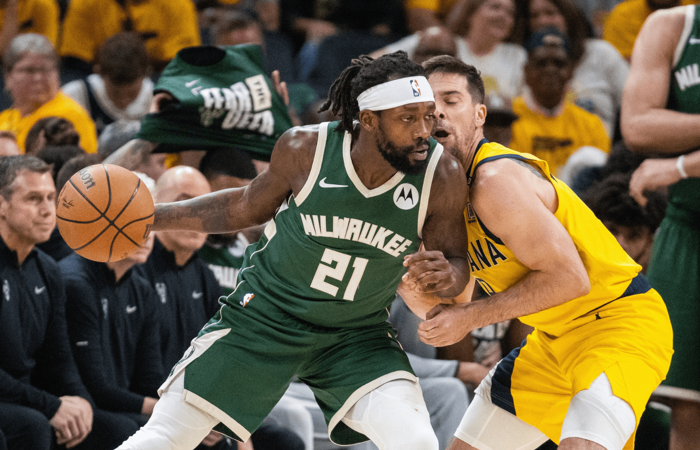 May 2, 2024; Indianapolis, Indiana, USA; Milwaukee Bucks guard Patrick Beverley (21) dribbles the ball while Indiana Pacers guard T.J. McConnell (9) defends during game six of the first round for the 2024 NBA playoffs at Gainbridge Fieldhouse. Mandatory Credit: Trevor Ruszkowski-Imagn Images